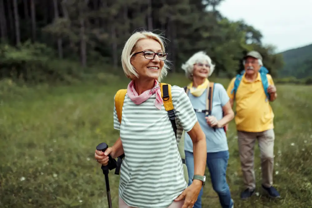 Seniors outside hiking on a summer day