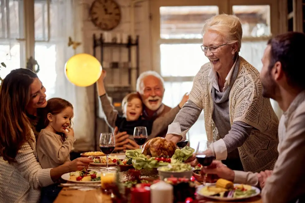 A family with senior parents celebrating Thanksgiving in Senior Living.