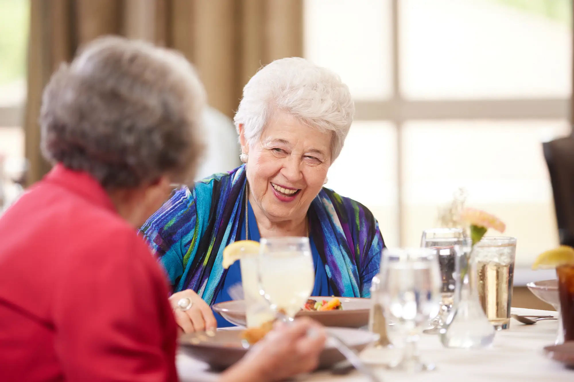 SBRK_2021_JUNE_COPPOLA__086 Two elderly women experiencing senior living dining at Sedgebrook in Lincolnshire, IL.