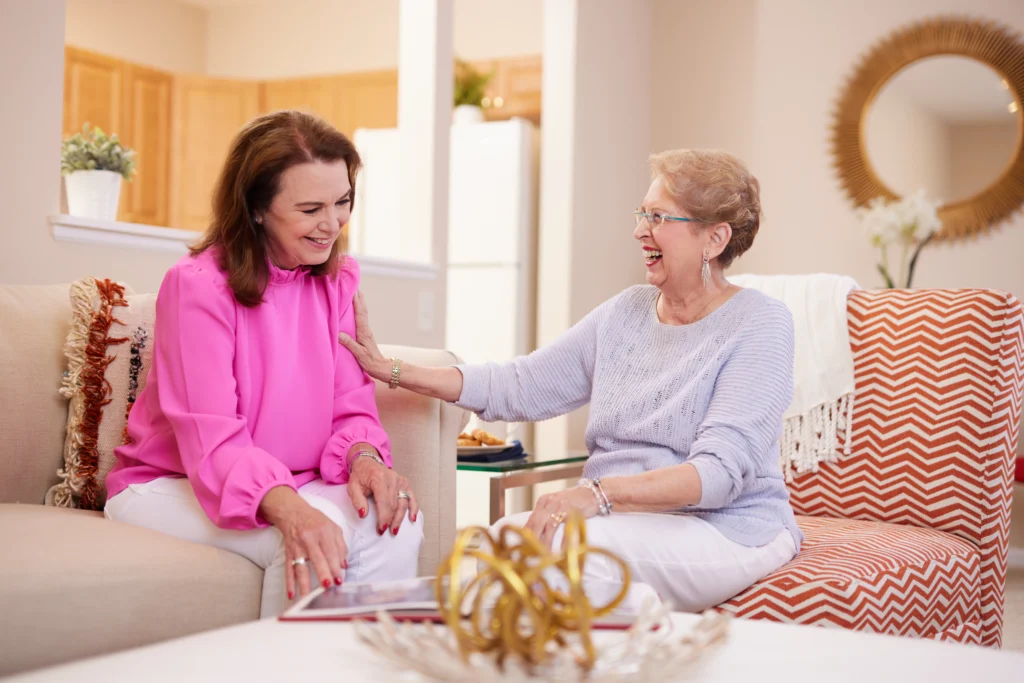 An adult child talking to her mother about the active independent senior living lifestyle at Sedgebrook in Lincolnshire, Illinois.