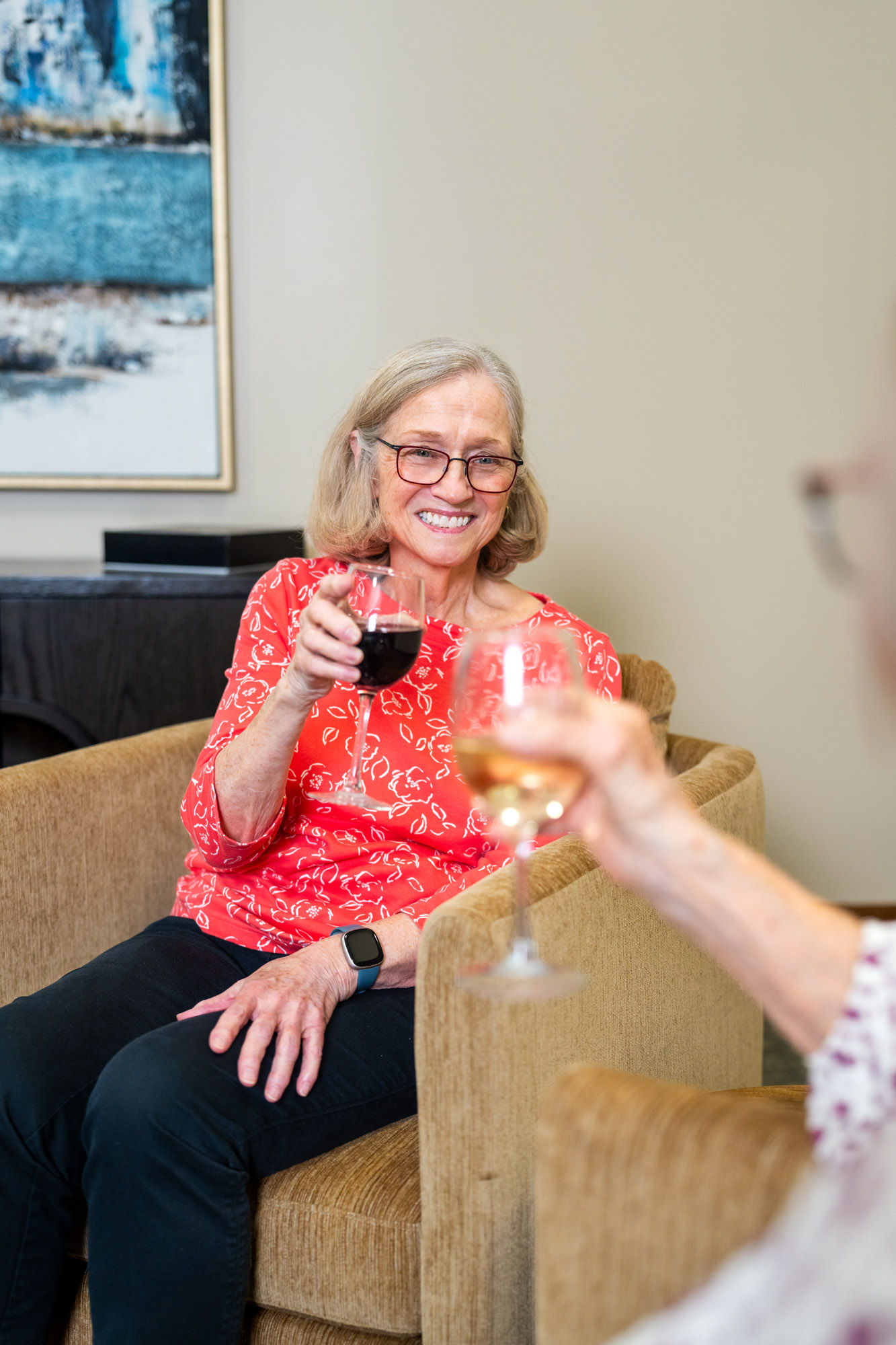 senior drinking wine