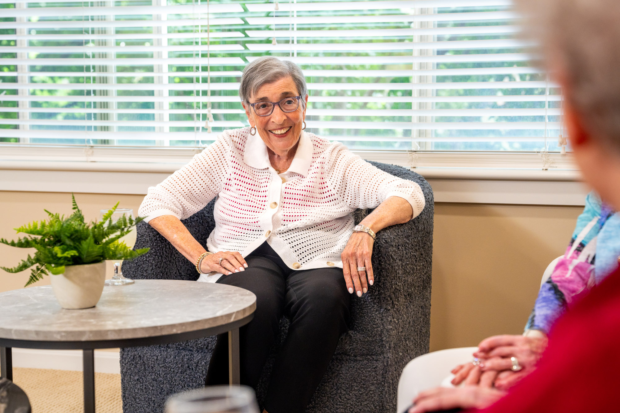 Senior woman sitting down